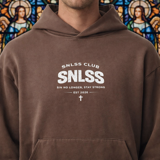 Brown hoodie with 'SNLSS CLUB' text in front of a stained glass window